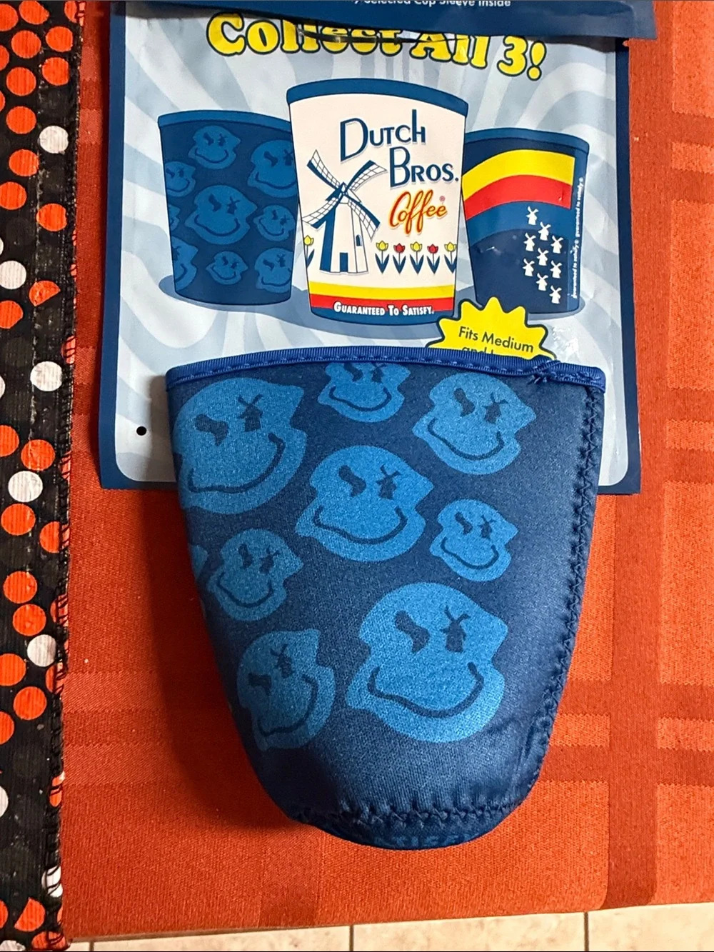 Dutch Bros Blue Mystery Cold Cup Sleeve with Smiley Pattern